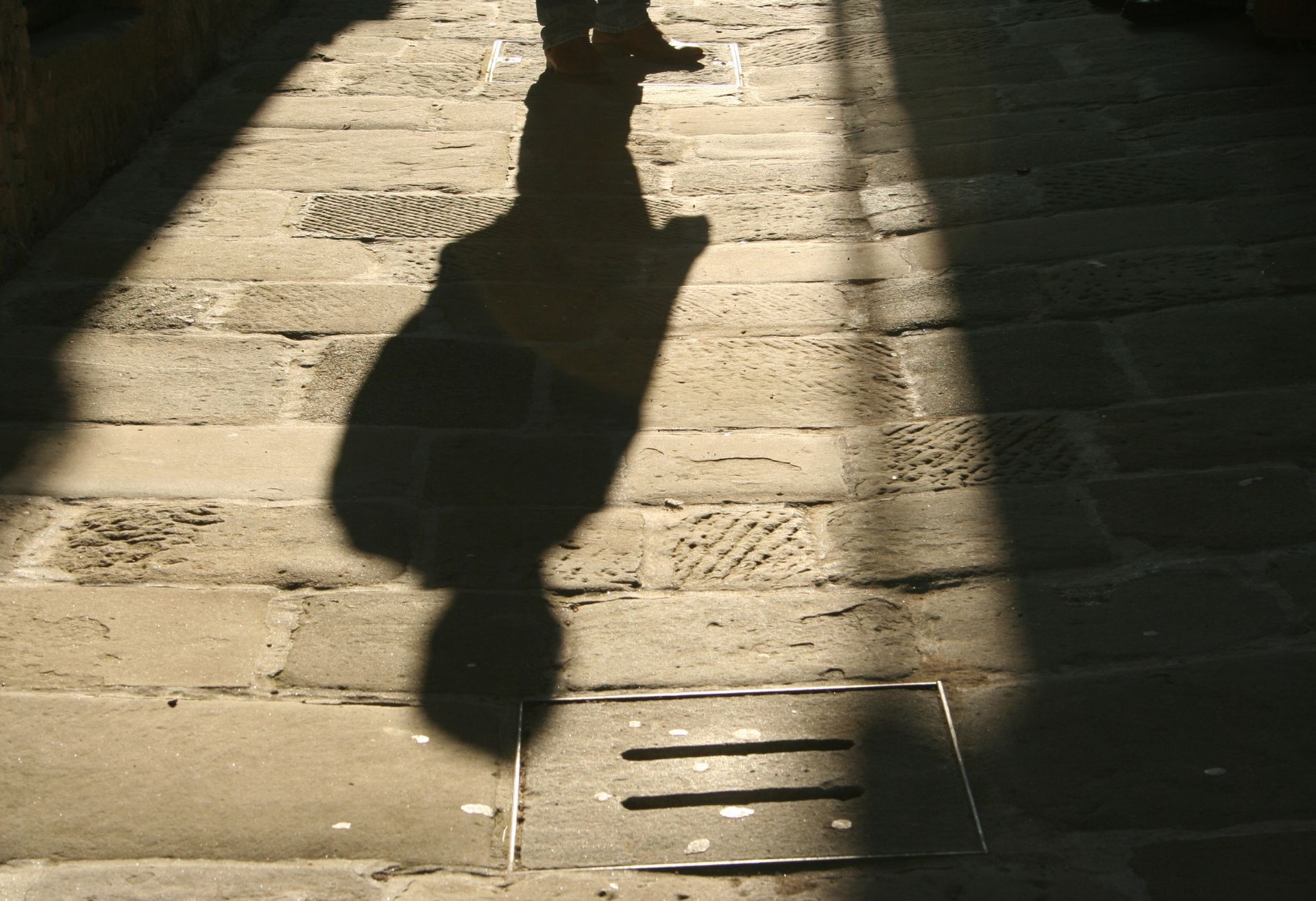 Image of man's shadow on a road