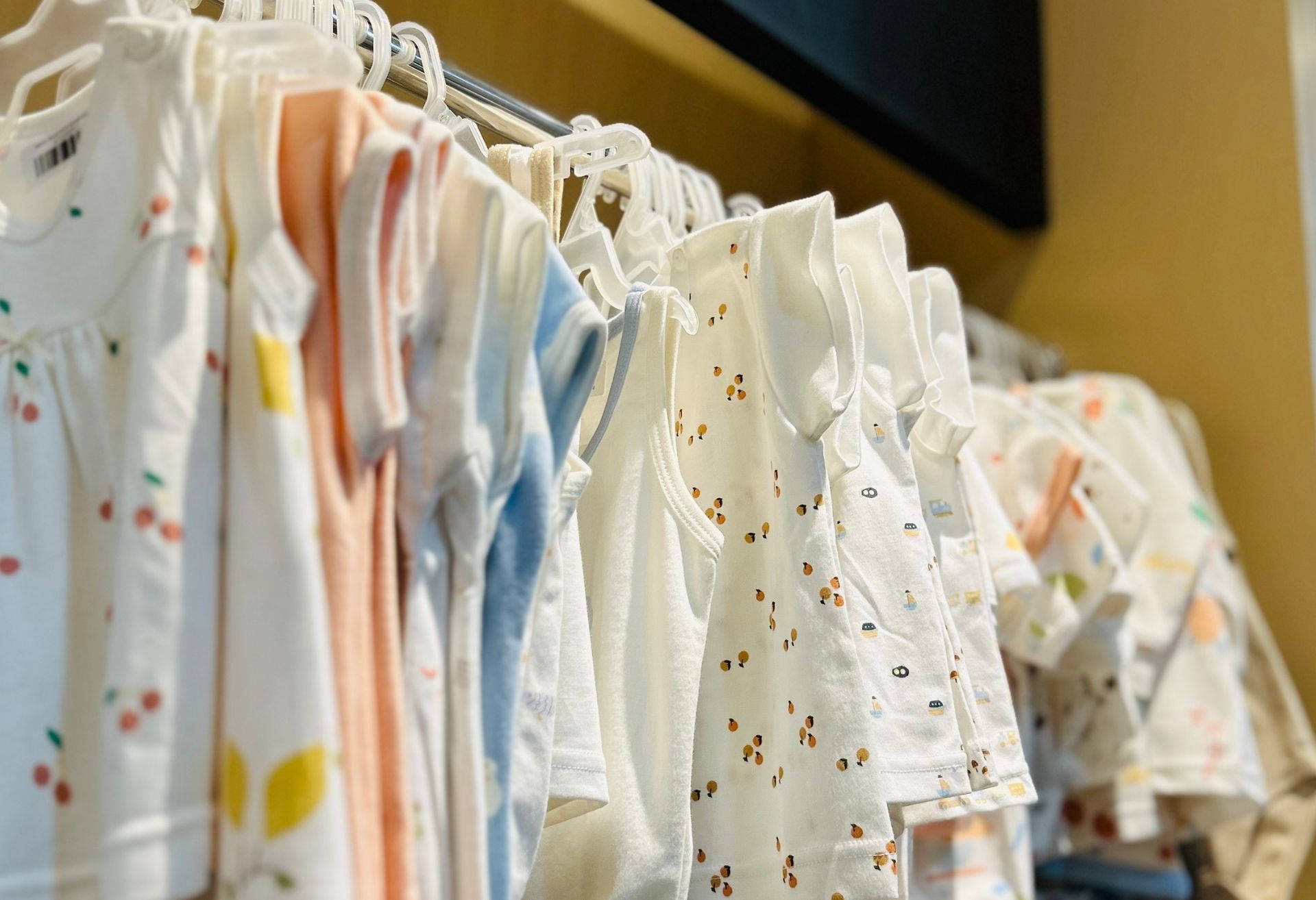 Baby clothes on a rail